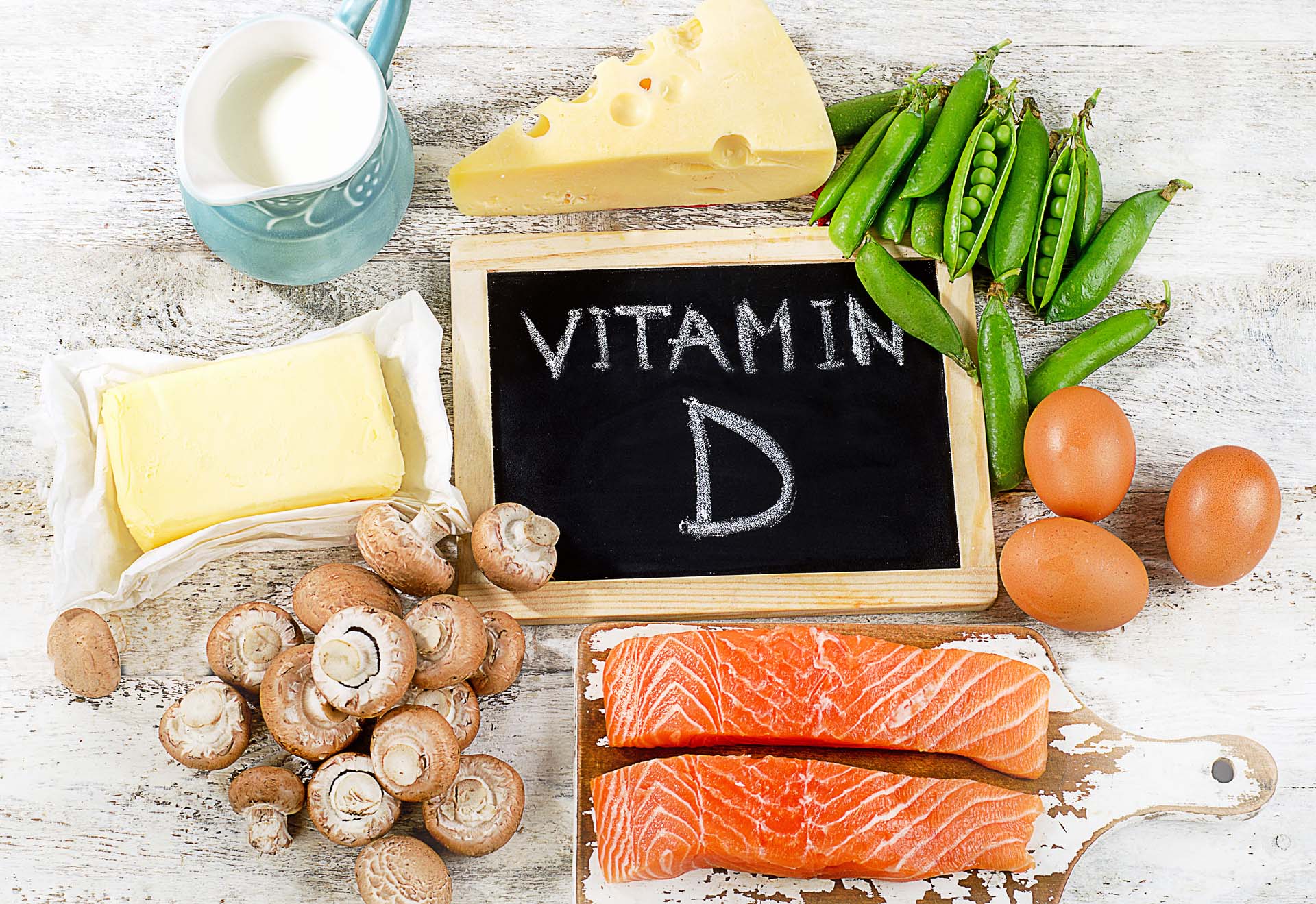 A blackboard saying Vitamin D surrounded by food which is rich in it