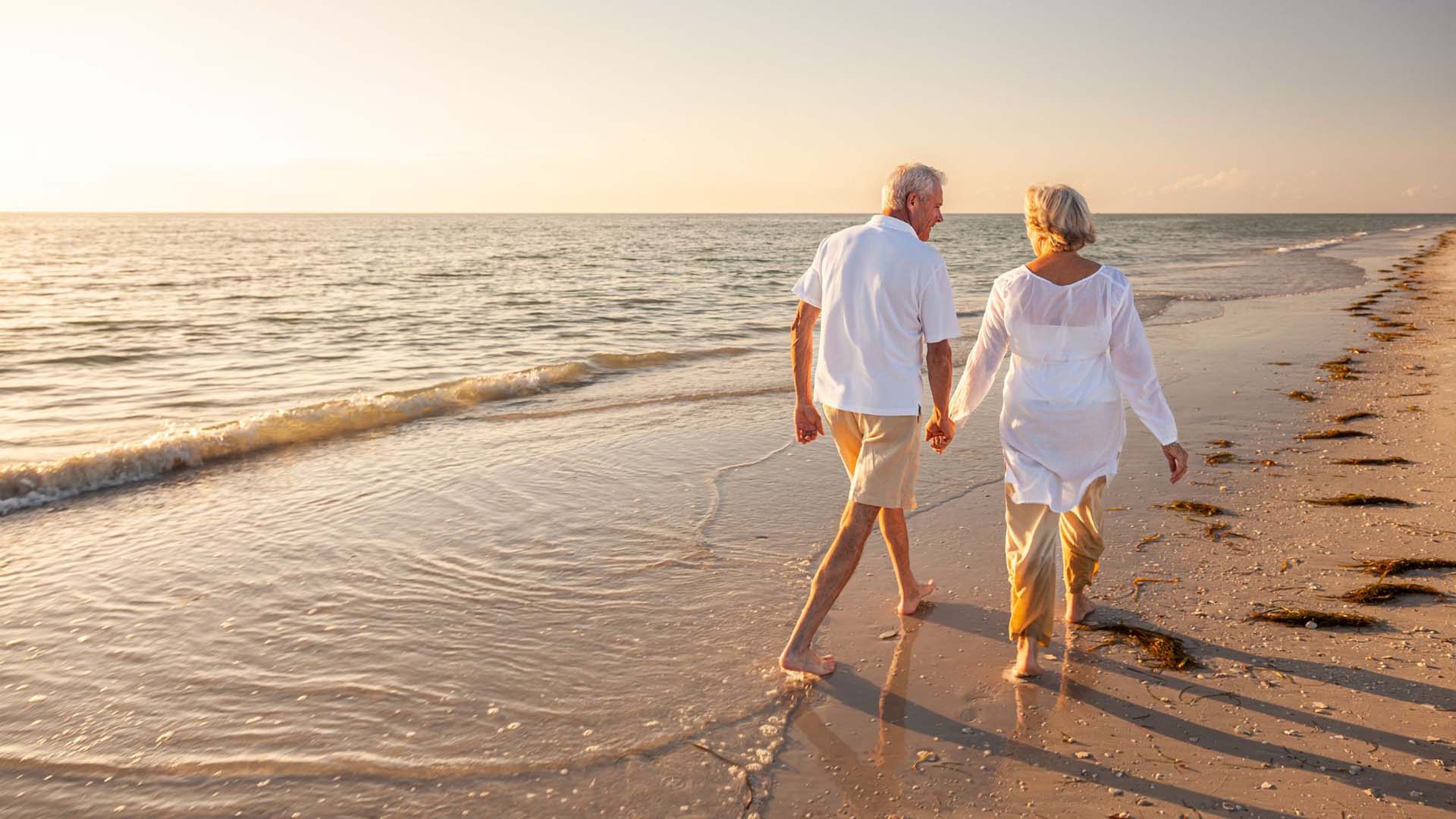 couple walking along a beach