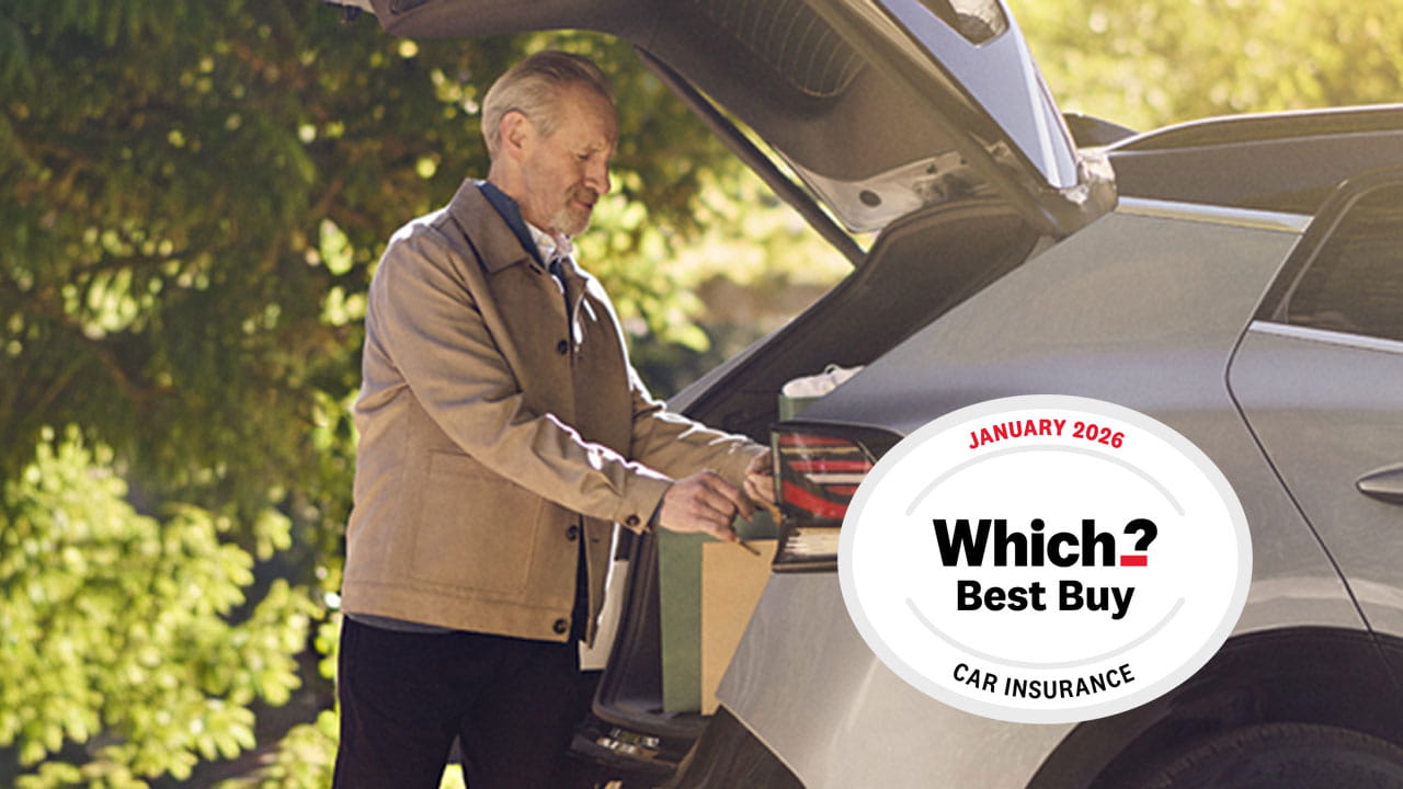 A man unloading the boot of a silver SUV outside a brick house while another person walks toward the front door; a ‘Which? Best Buy’ award badge appears on the right side of the image.