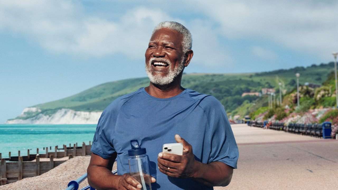 Man walking along sea front