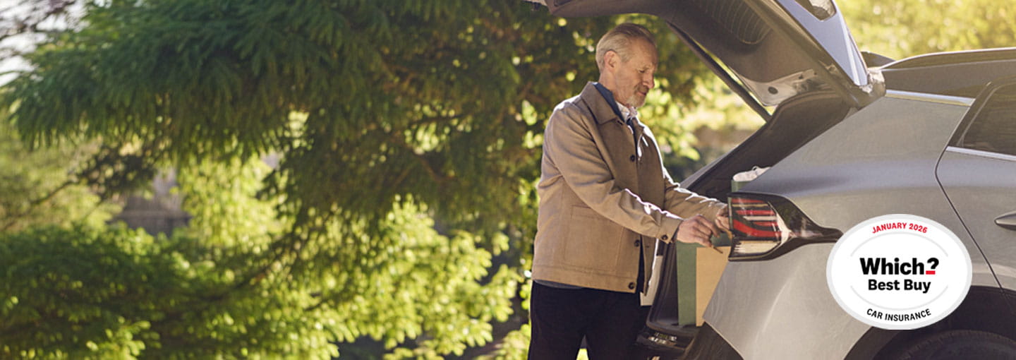 A man unloading the boot of a silver SUV outside a brick house while another person walks toward the front door; a ‘Which? Best Buy’ award badge appears on the right side of the image.