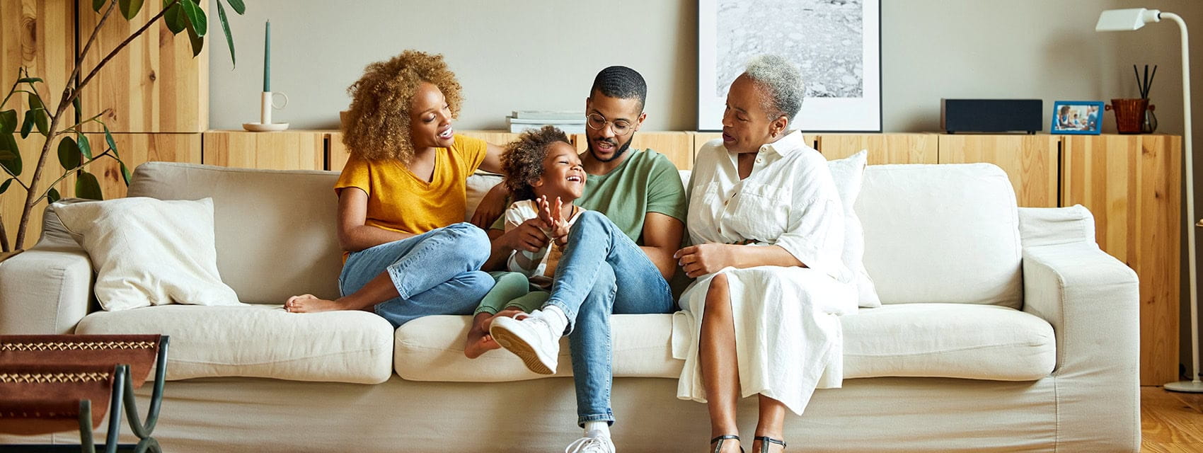 3 generation family  sitting on the sofa