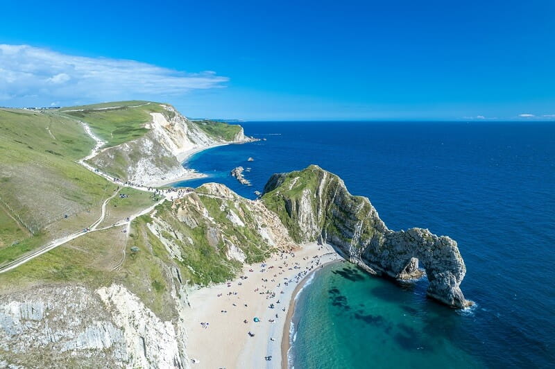 The limestone arch at scenic Durdle Door with clear blue skies