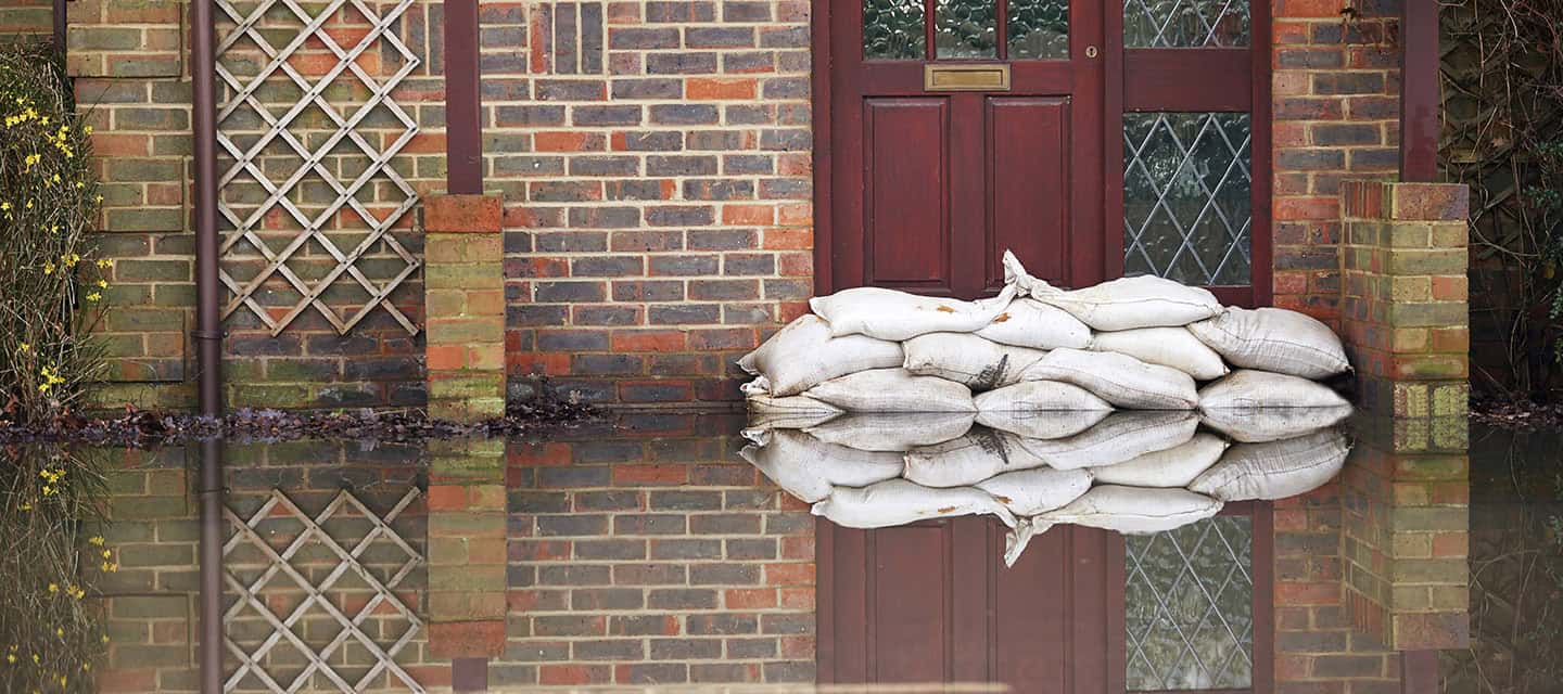 Sandbags near house door during flood.