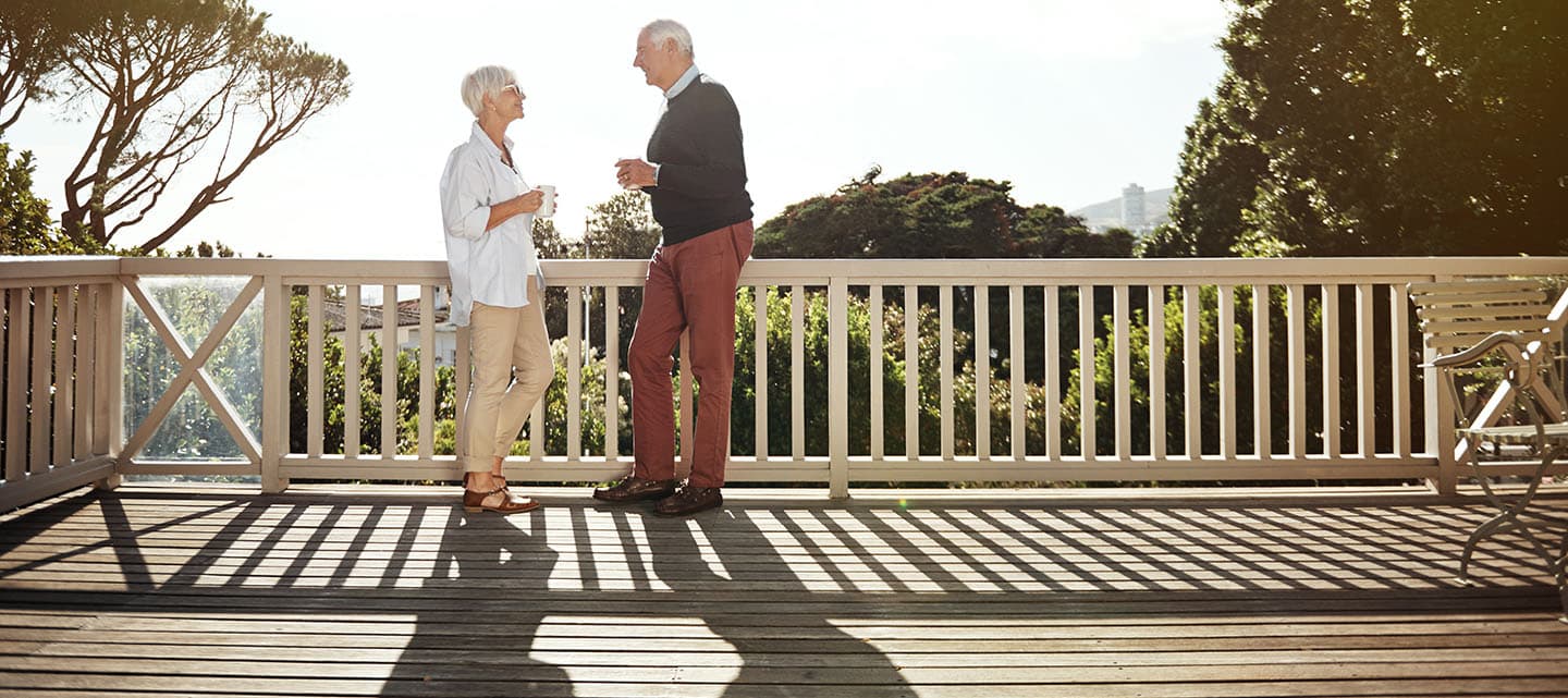 Shot of a senior couple having coffee together on their balcony at home
