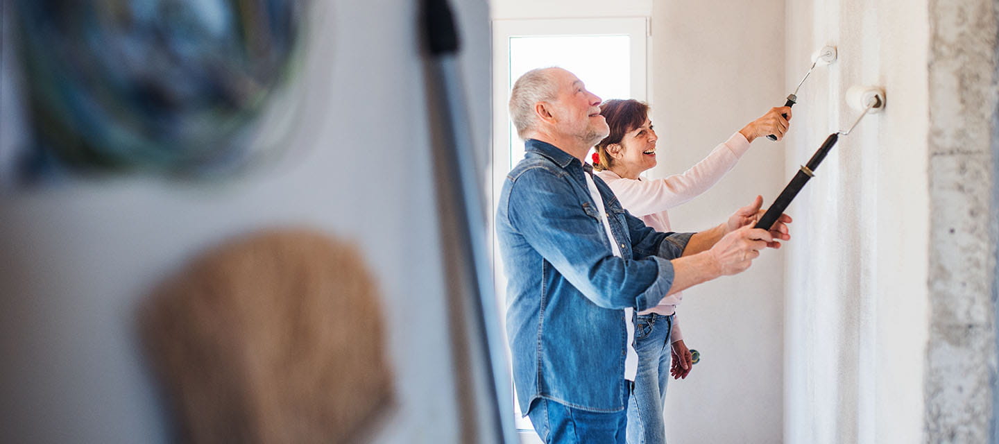 A couple decorating their home