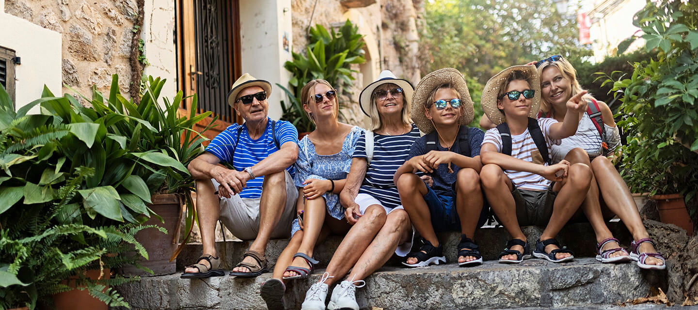 Multi generation family sightseeing beautiful town of Valldemossa, Majorca, Spain