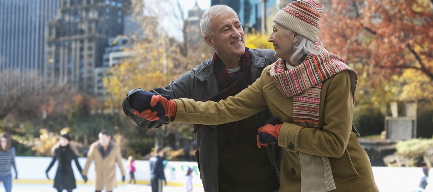 A senior couple ice skating in New York