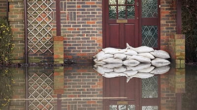 Sandbags near house door during flood 