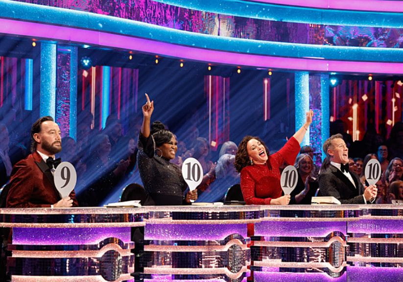 The four Strictly Come Dancing judges holding up their scores