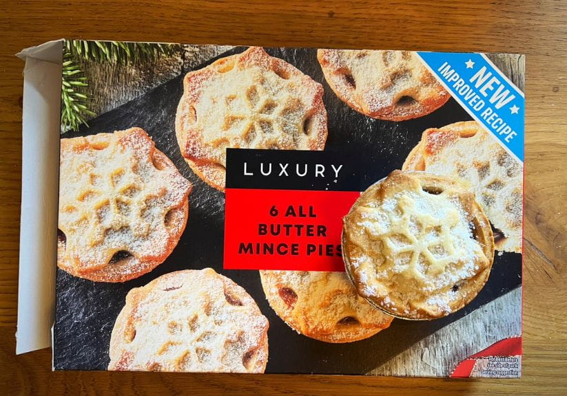 A box of Iceland Luxury Mince Pies on a wooden table top