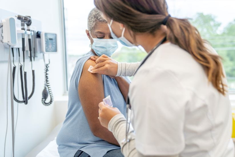 Nurse giving an RSV vaccine to a patient