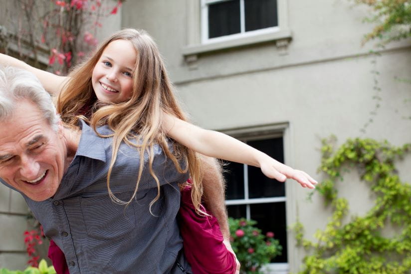 Granddaughter on her grandpas shoulders
