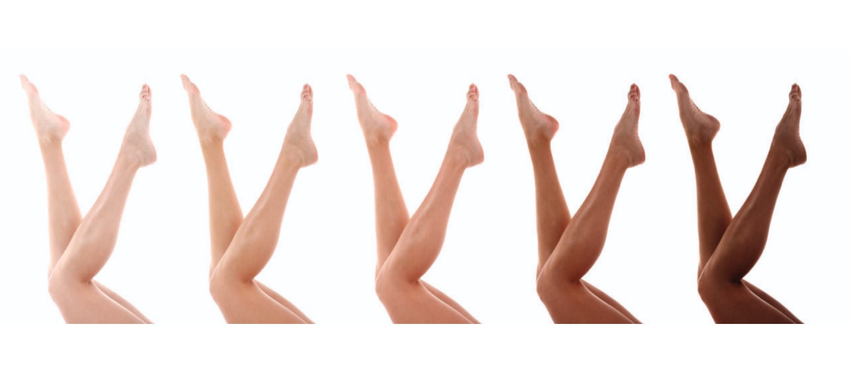 Five pair of legs in shades from very pale to very dark | Shutterstock