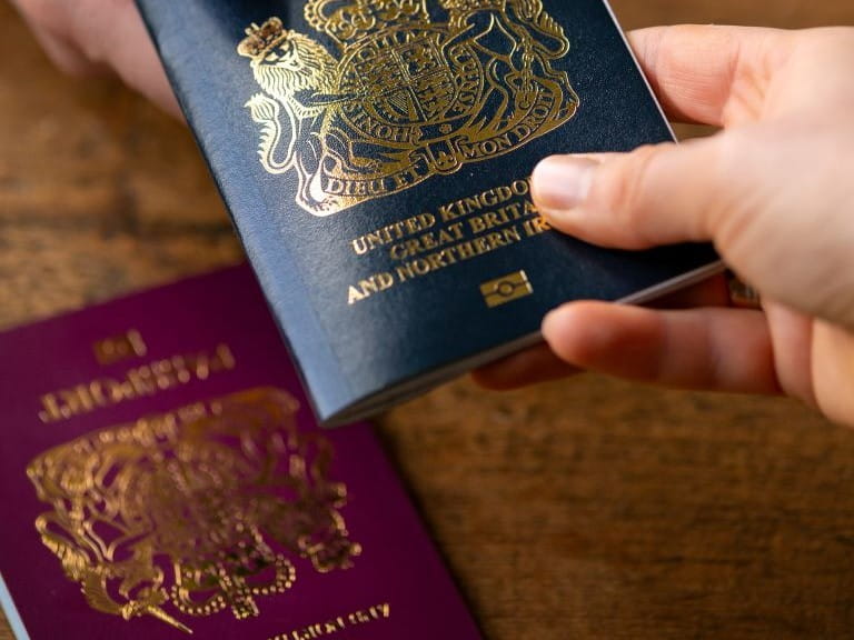 passport being passed from one person to another