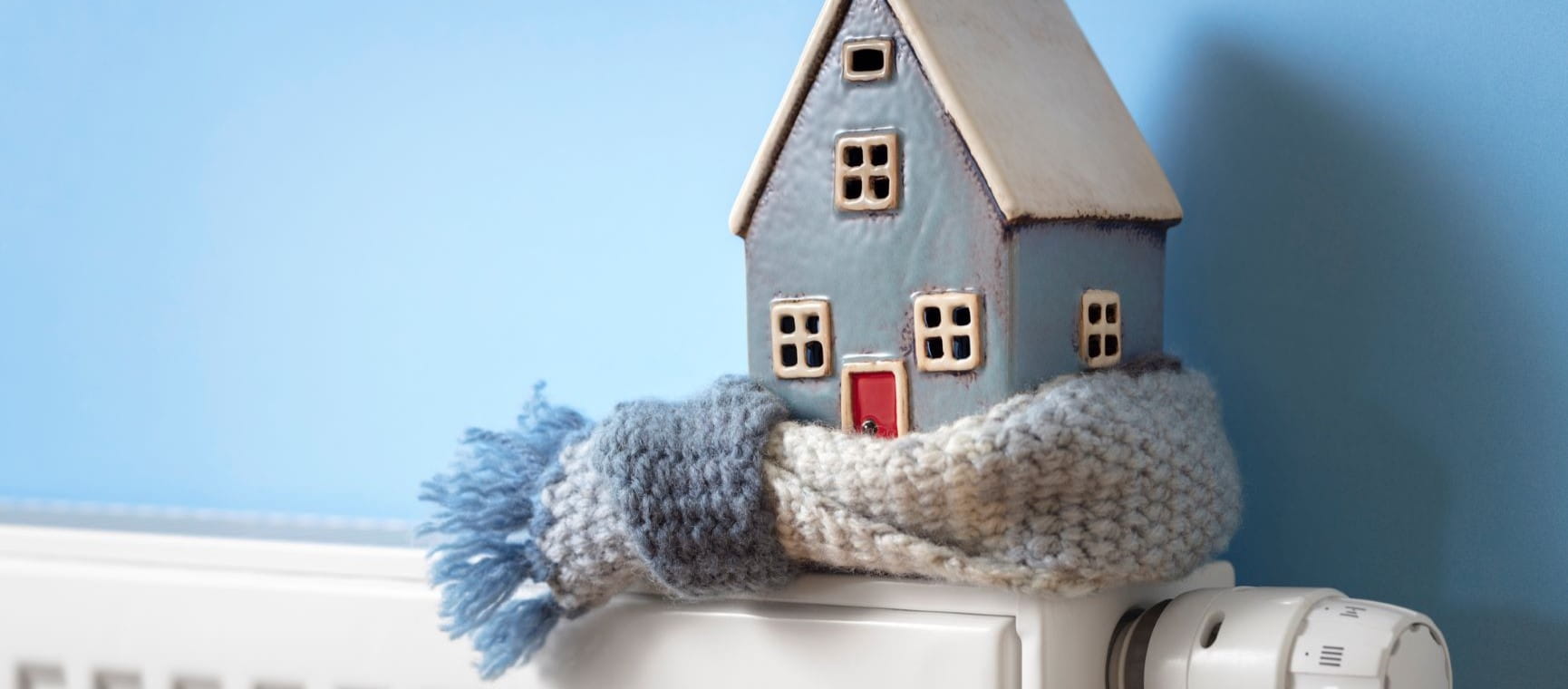 House wrapped in a scarf on a radiator