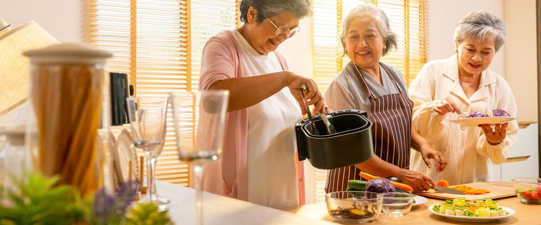 Ladies in the kitchen preparing air fryer food