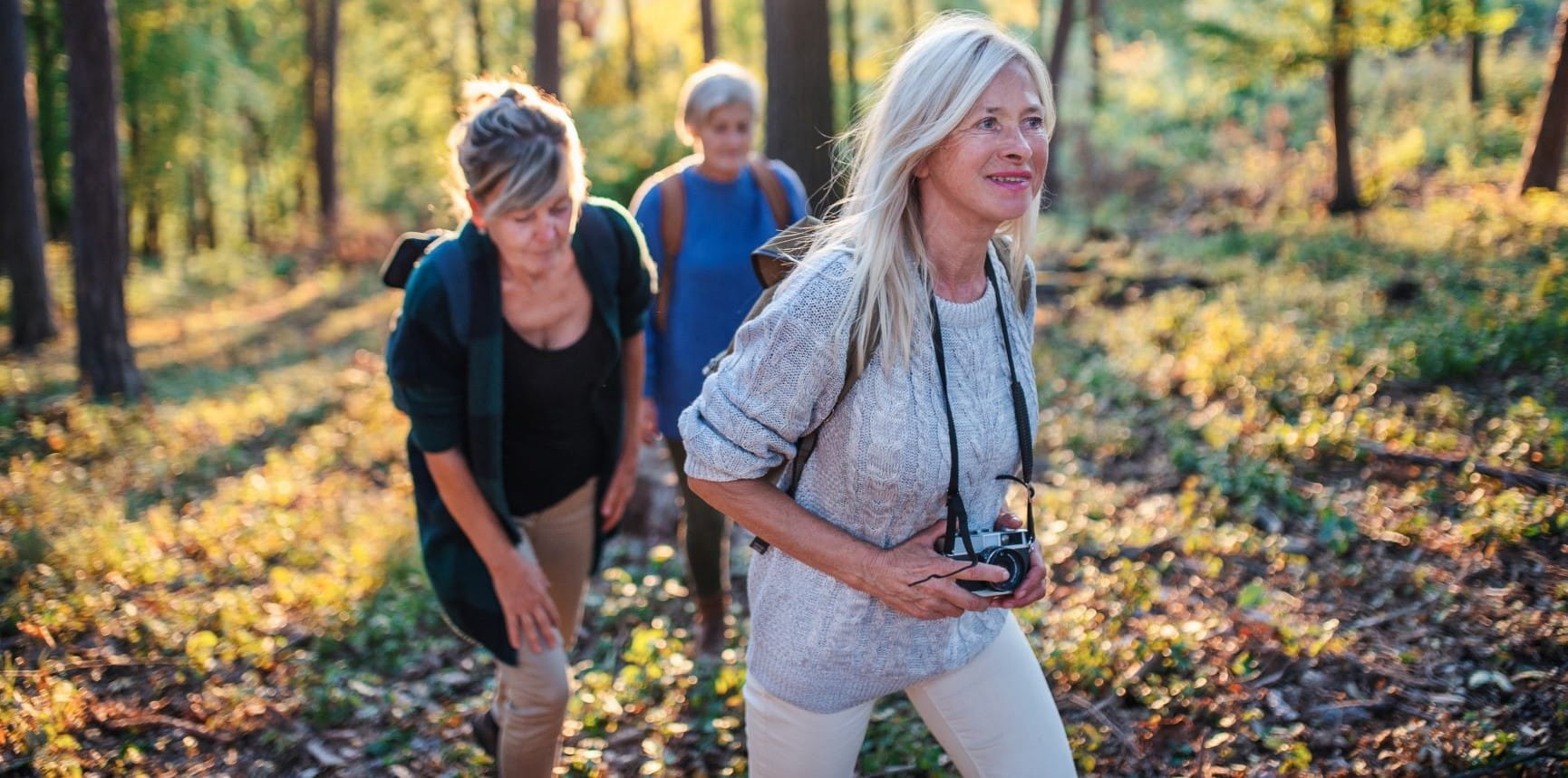 women walking in the forest