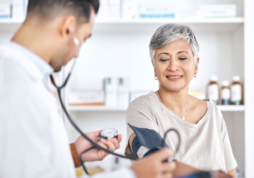 woman getting her blood pressure taken