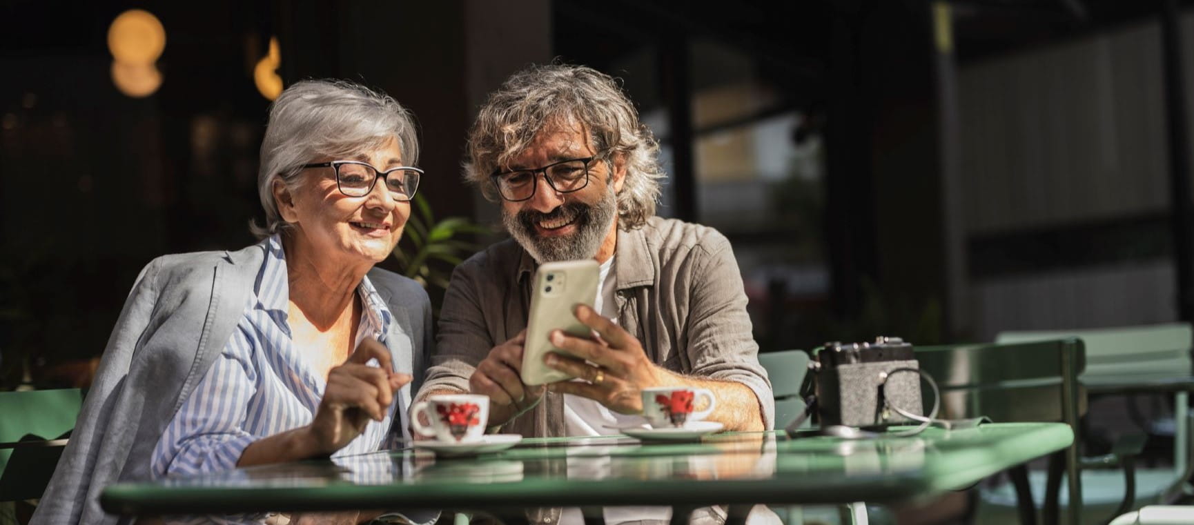Couple happily looking at a phone