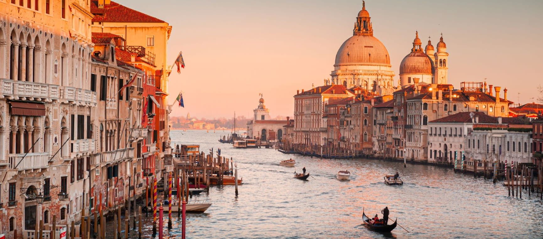 Grand Canal and Basilica Santa Maria della Salute in Venice, Italy, at sunset