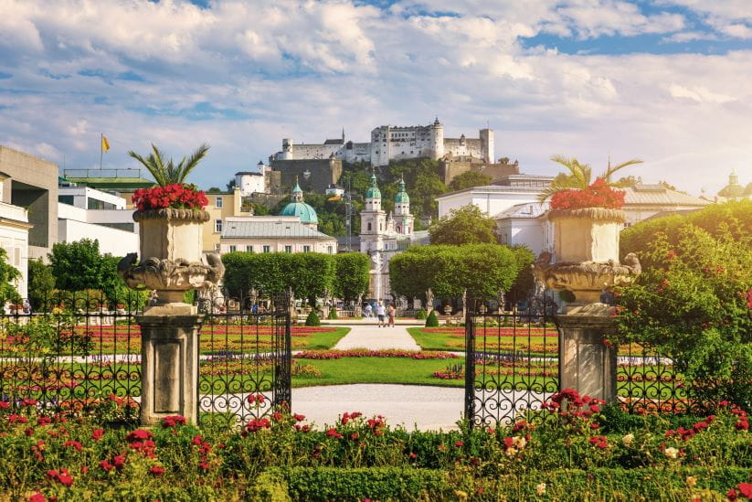 Beautiful view of famous Mirabell Gardens with the old historic Fortress Hohensalzburg in the background in Salzburg, Austria