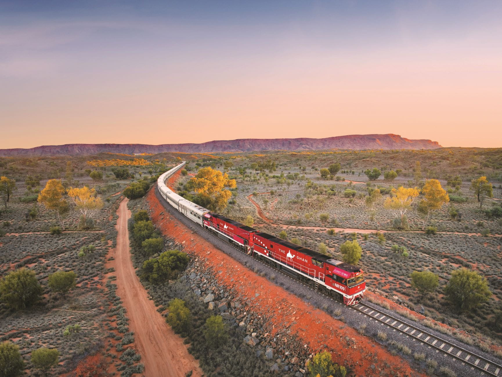 The Ghan train going through the Macdonnell ranges