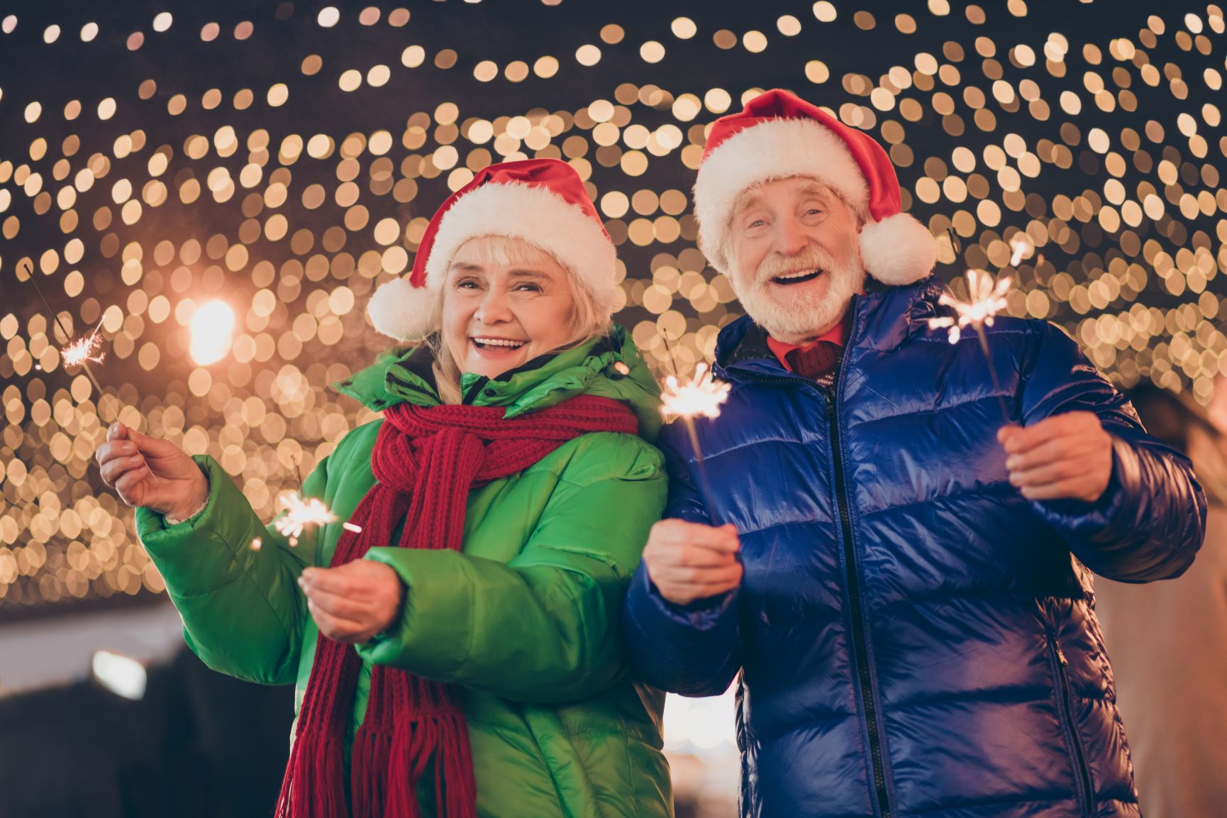 couple with sparklers at christmas