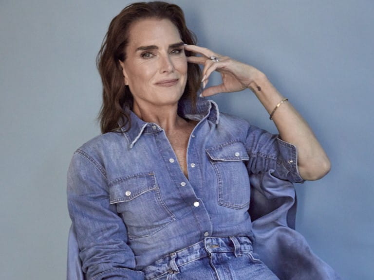 Brooke Shields sitting dressed in denim 