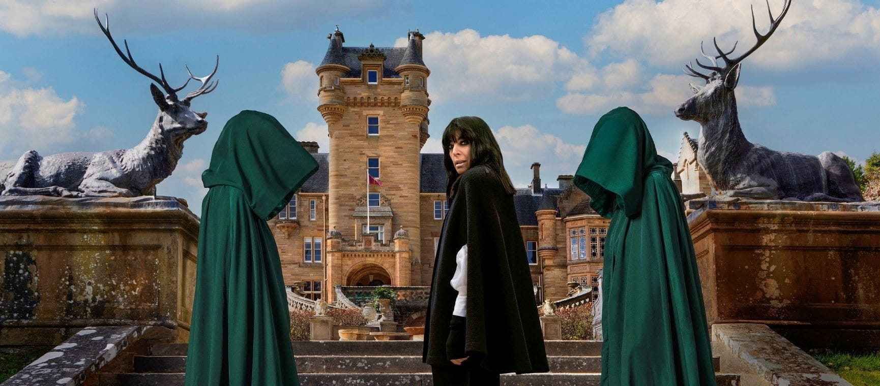 Claudia in front of The Traitors castle