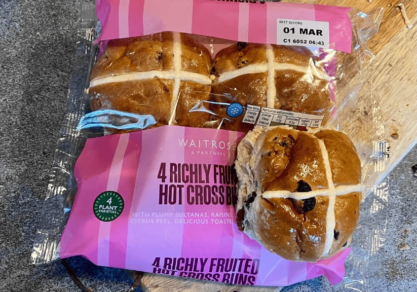 a packet of Waitrose richly fruited hot cross buns 2026