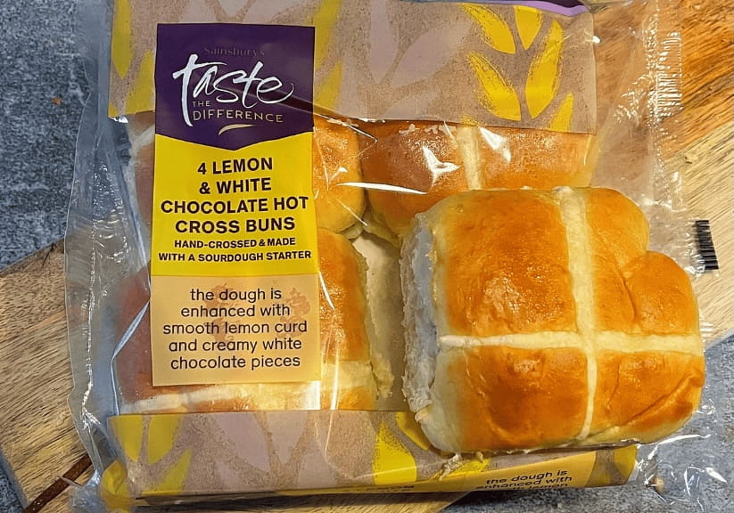 A packet of Sainsbury's lemon and white chocolate hot cross buns