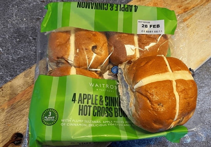 A packet of Waitrose Apple and Cinnamon hot cross buns