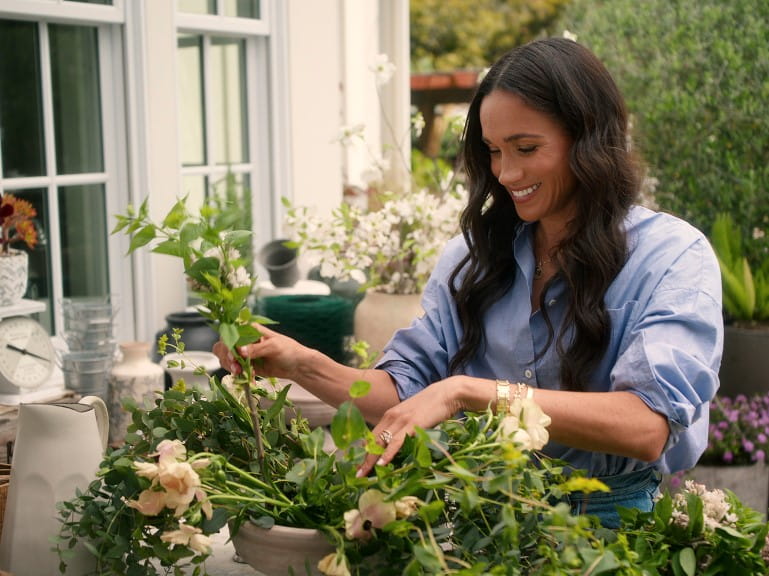 A still from Meghan Markle's new Netflix series where she is gardening