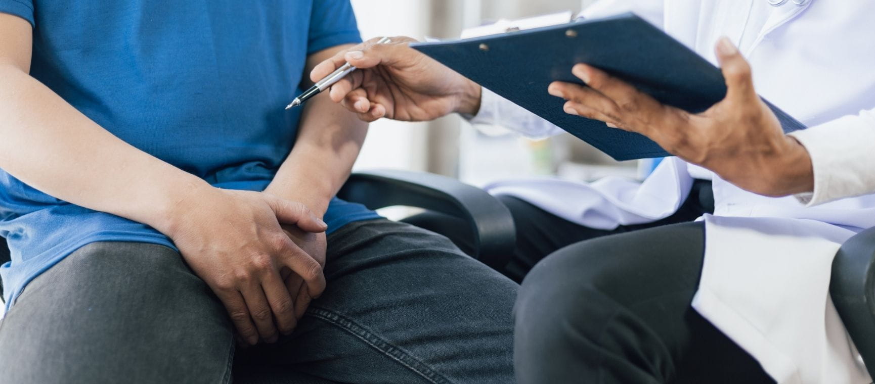 A man having a talk with a doctor about prostate issues