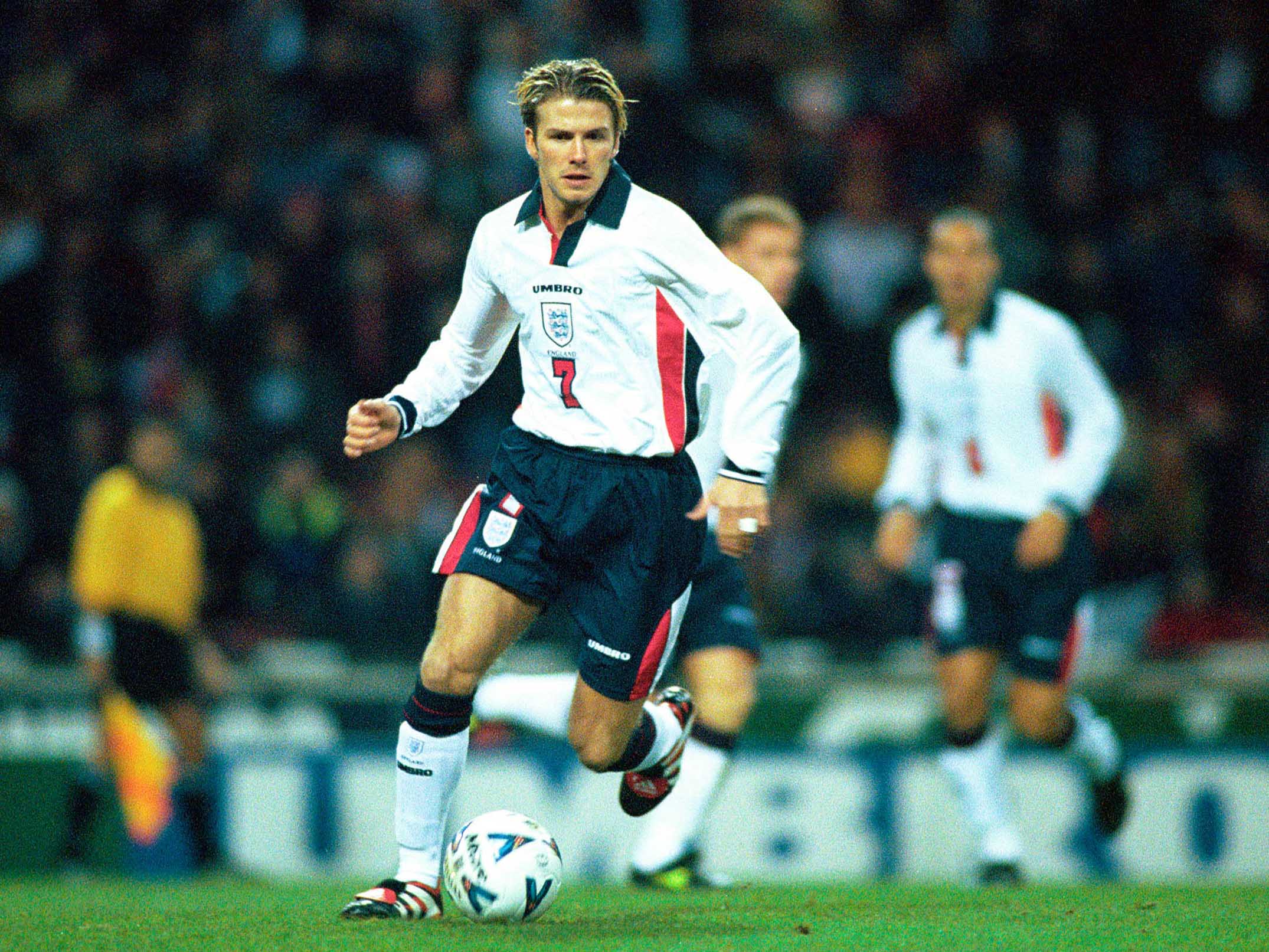 David Beckham on the pitch playing football in his 20s