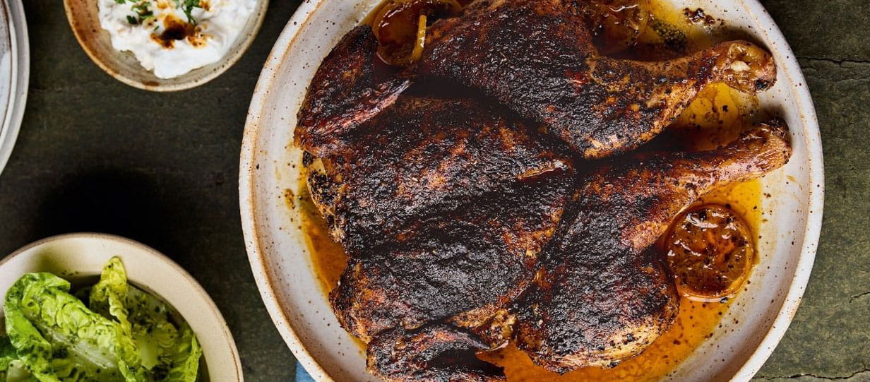 A whole cooked chicken on a plate