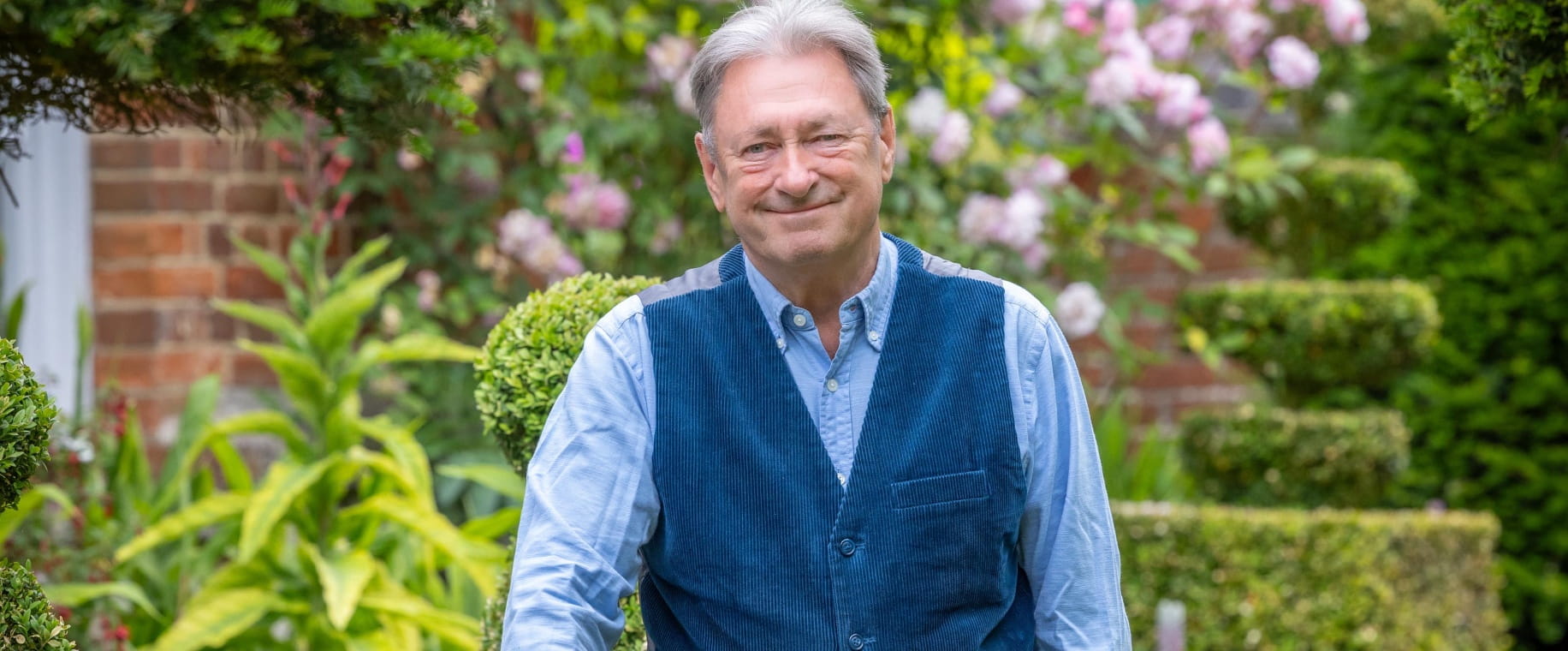 Gardener and TV personality Alan Titchmarsh in a garden
