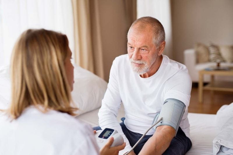 An older man having his blood pressure measured