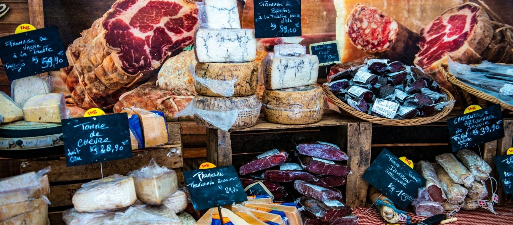 A display of ham and cheese in a French deli