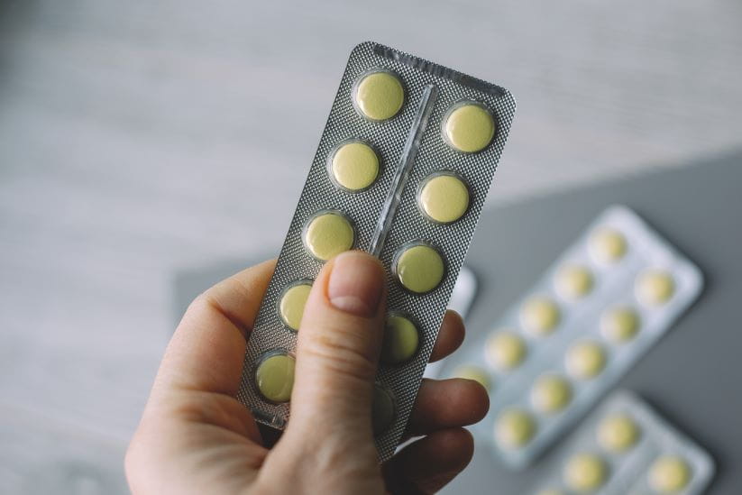 A blister pack of yellow pills