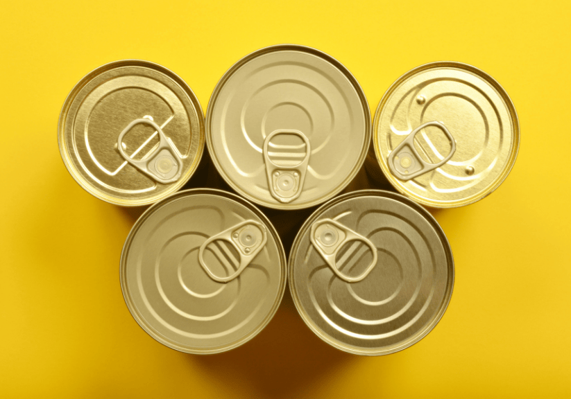 The top of five tins of canned food