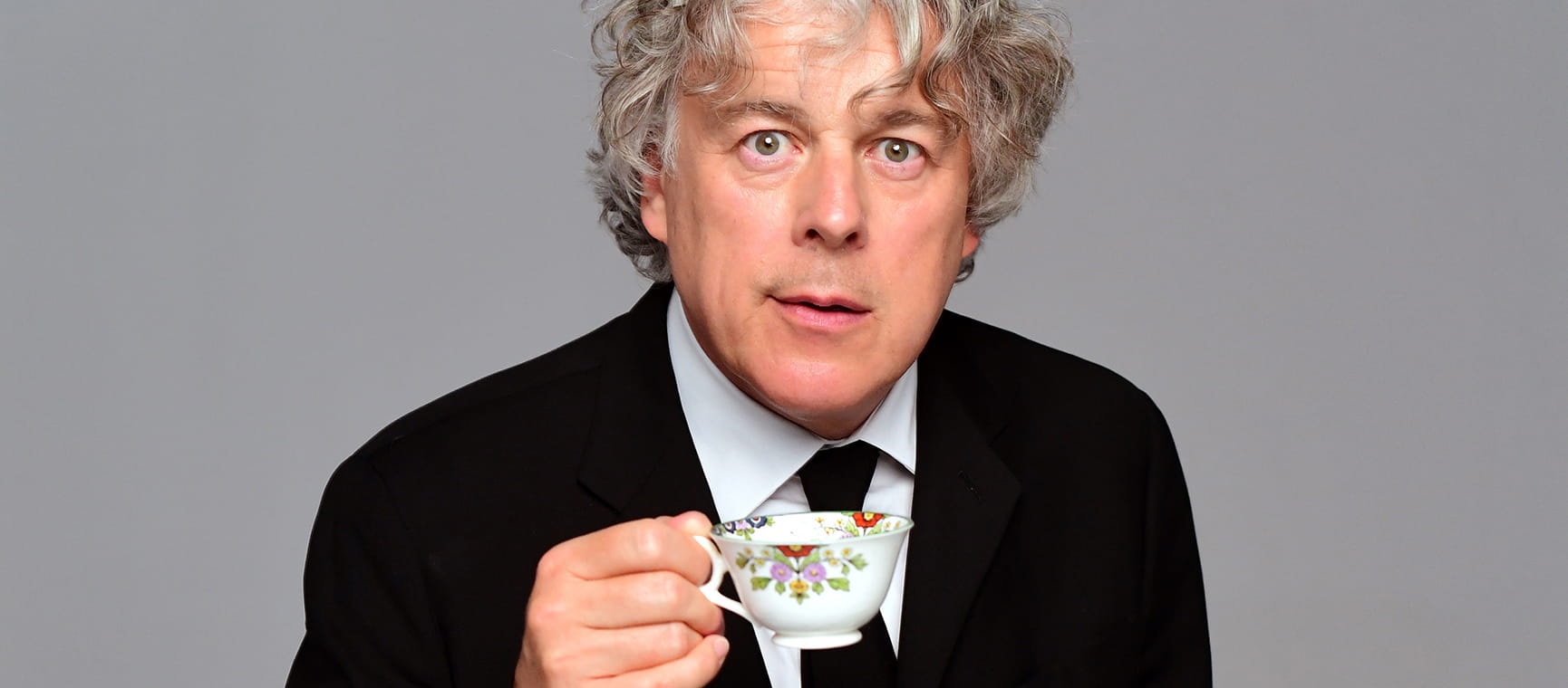Alan Davies with a cup of tea
