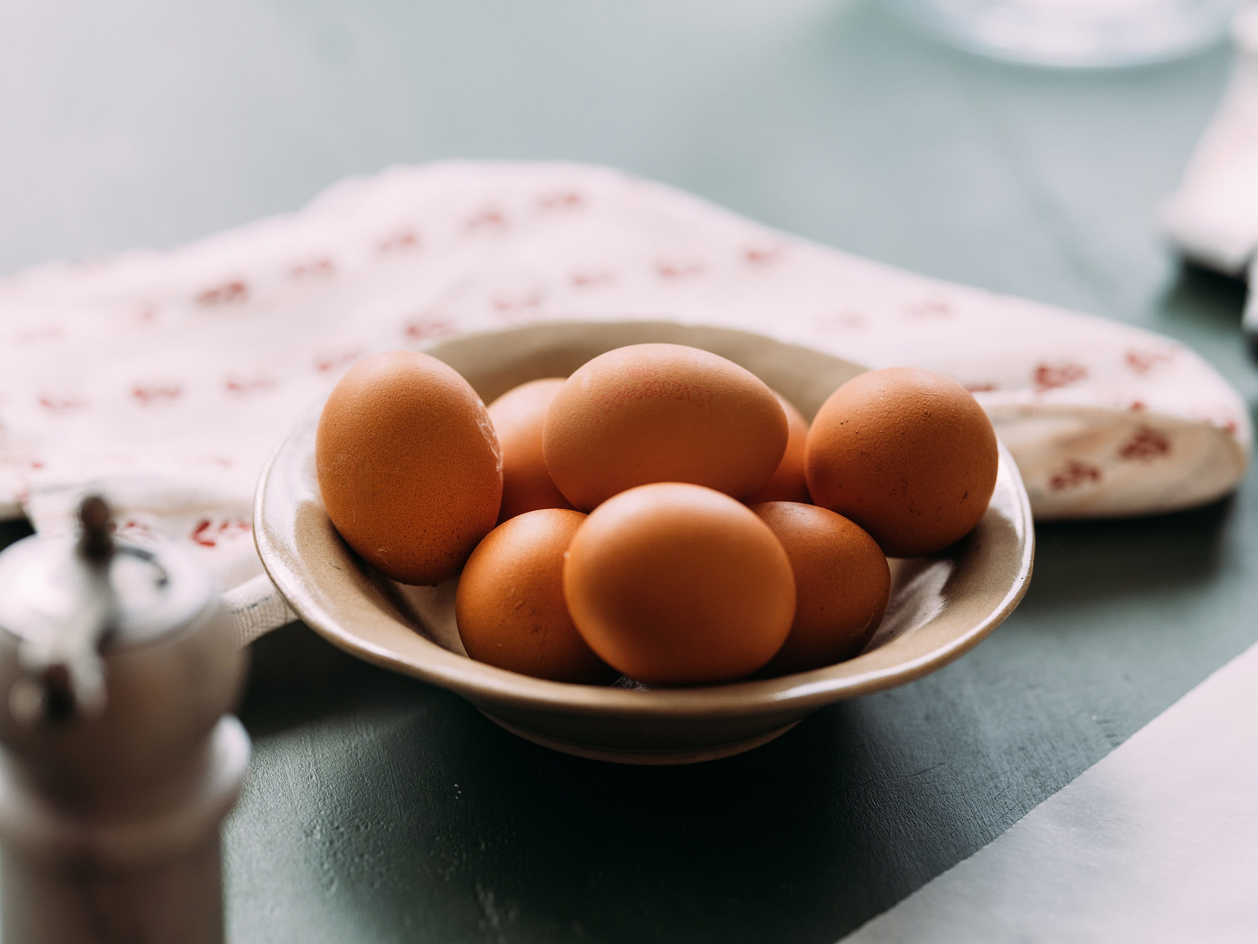 A bowl of eggs at the breakfast table