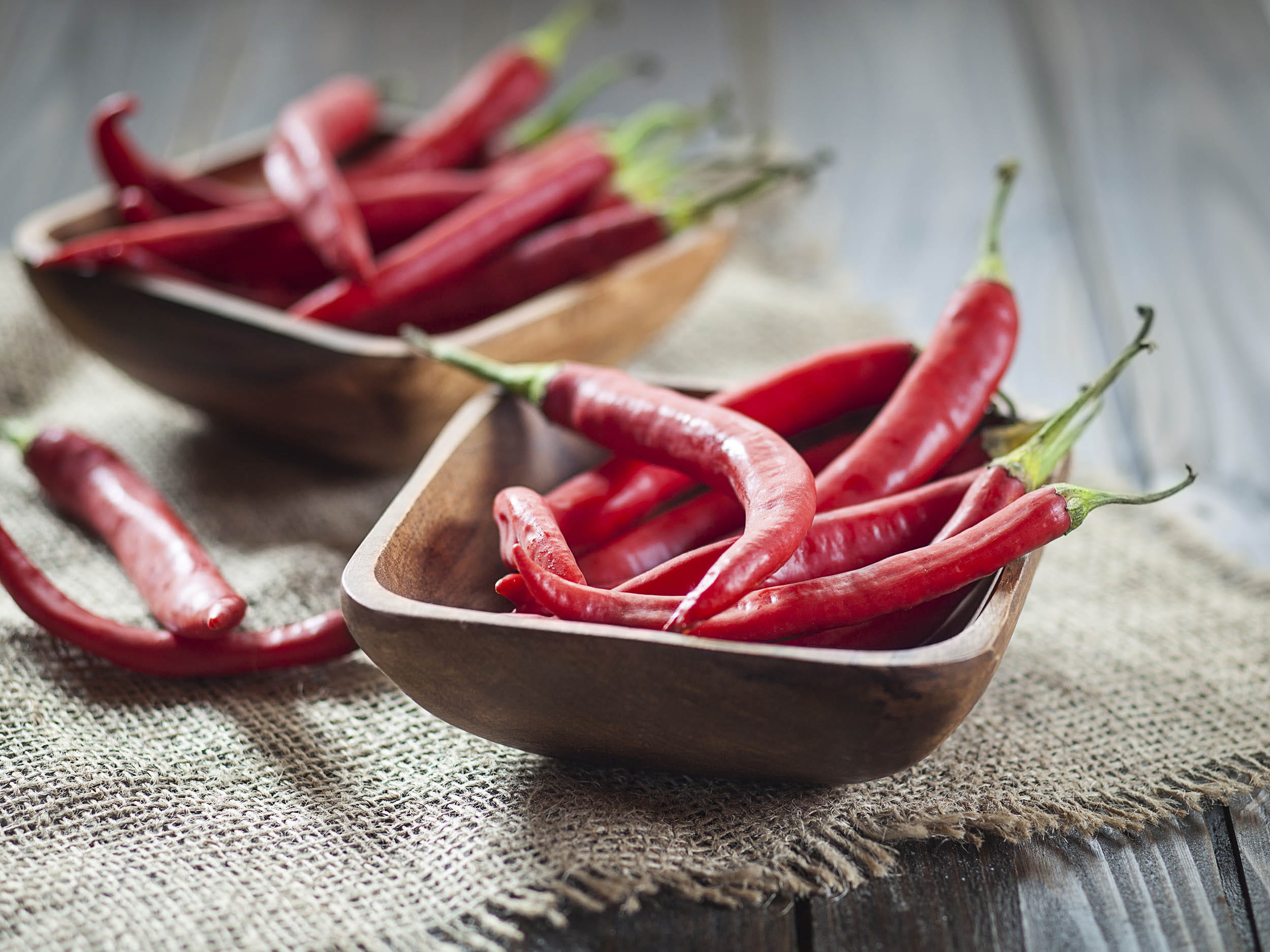 Two bowls of red chilli peppers