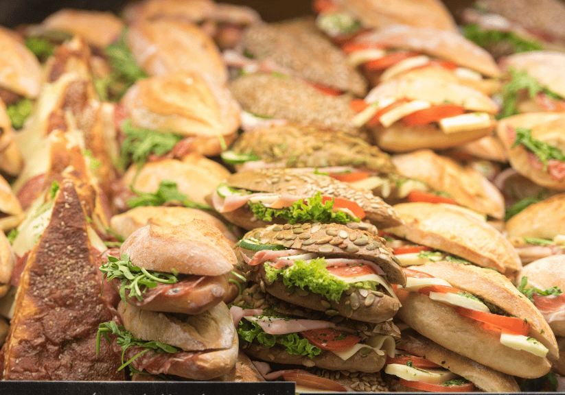 An assortment of tasty looking rolls and sandwiches