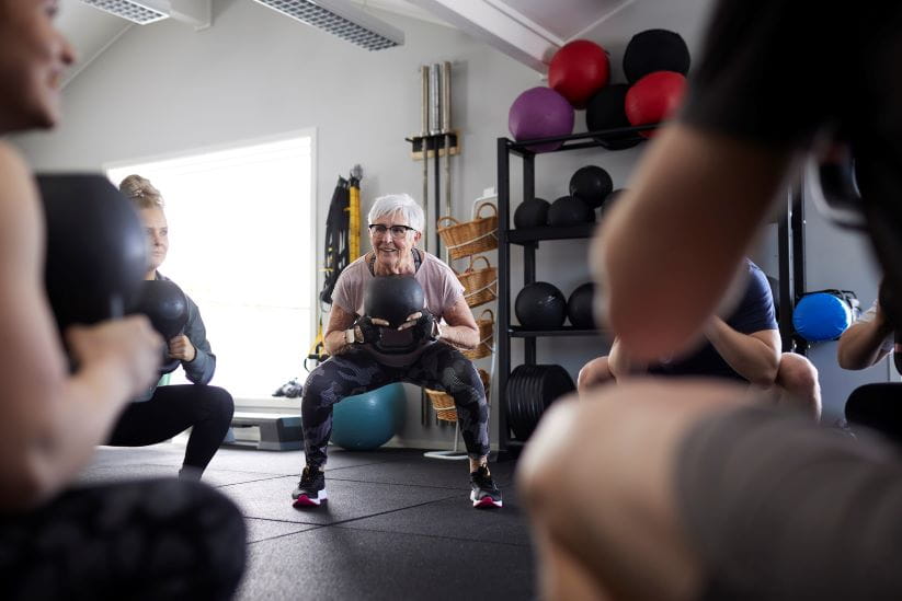 Group in the gym with medicine balls