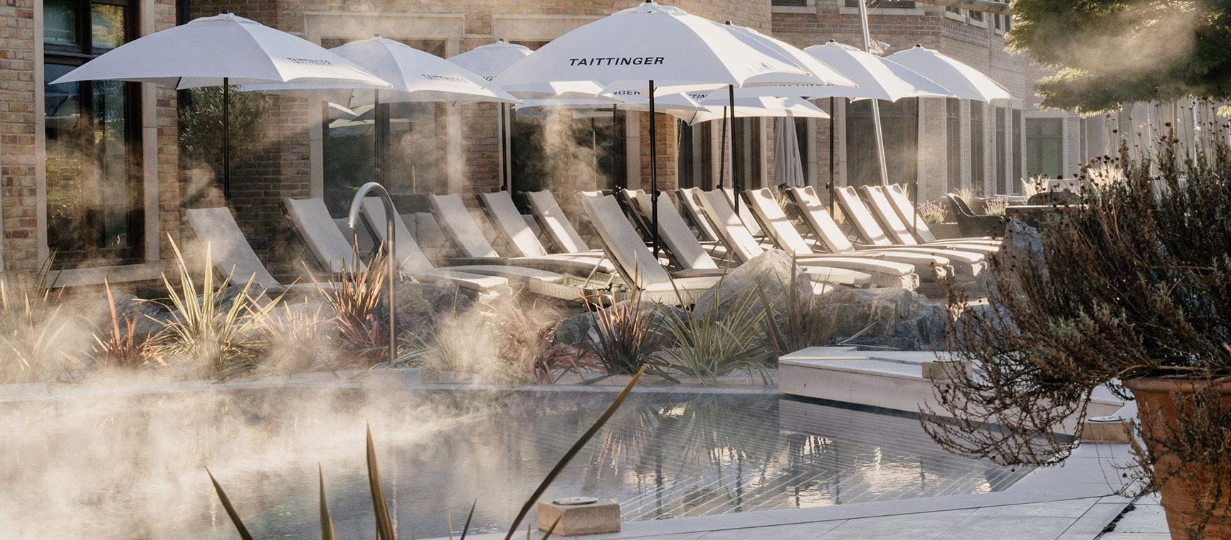 Rows of loungers beside an outdoor pool