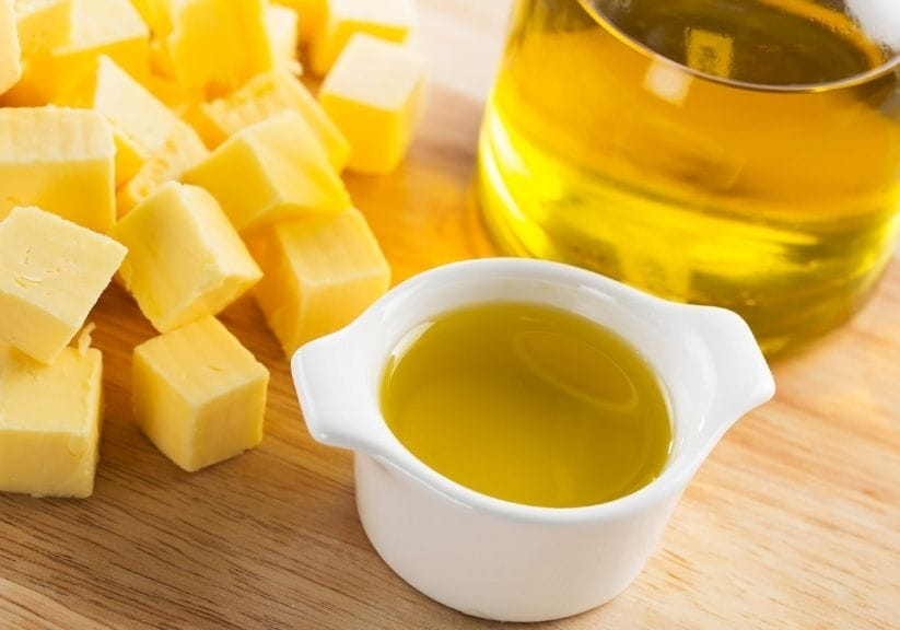 cubes of butter next to containers of oil
