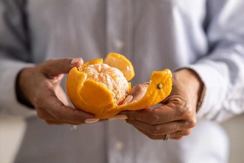 An orange being peeled